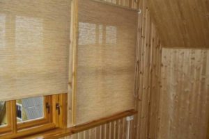 Roller blinds on wooden windows