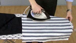 Steaming a jacket with an iron through the fabric