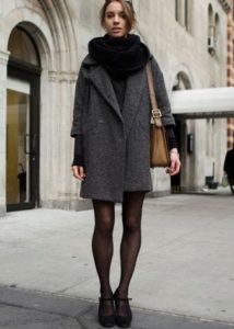 Black scarf under a gray coat