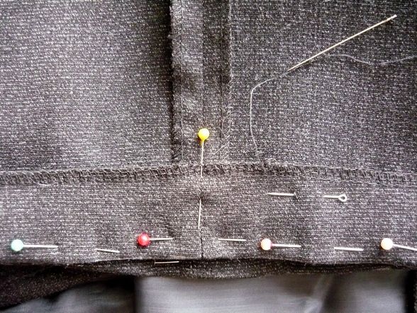 Hemming trousers by hand