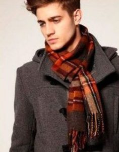 tie a scarf on a man's coat