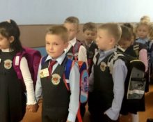 children with chevrons on vests