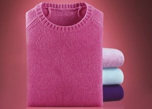 folded pink sweater