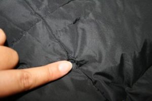 Sew up a hole in a down jacket