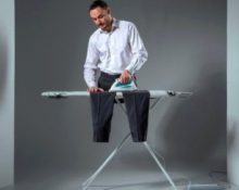 man ironing pants