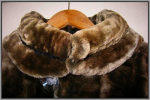 fur coat on a wooden hanger