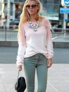 light pink sweater at gray jeans