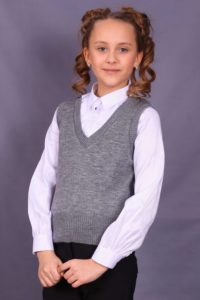 girl in a gray vest