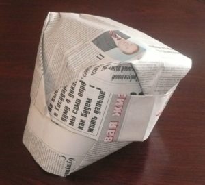 Hat with newspaper visor