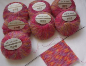 Reddish mohair with knitting needles