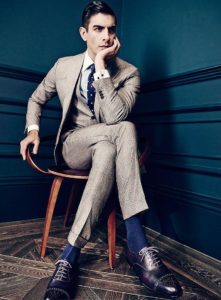 Blue socks with black shoes and tie