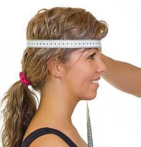 A girl's head size is measured