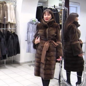 choosing a fur coat from a mouton