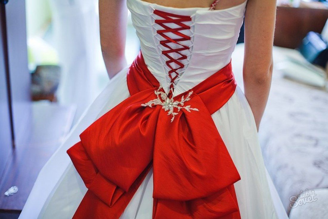 Luxurious red bow on the belt