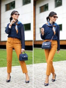 mustard trousers with a blue bag