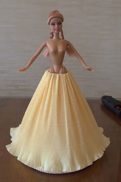 Yellow skirt made of corrugated paper for a doll 