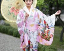 in a kimono with an umbrella