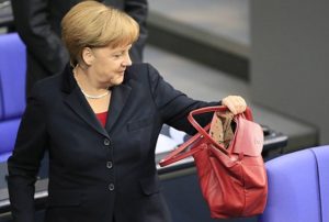 Who chooses ridiculous costumes for Merkel