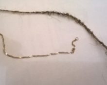 How to remove hair from a gold chain