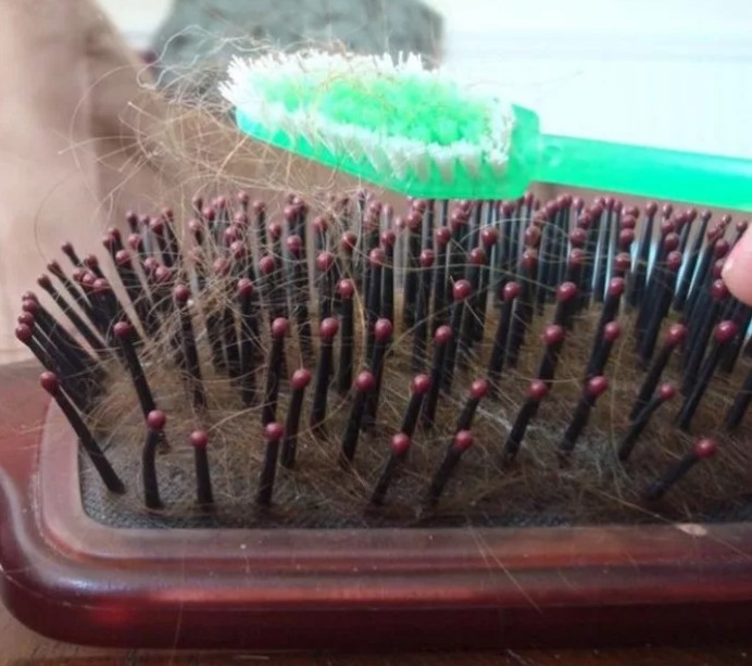 cleaning combs with a toothbrush