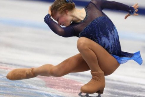 Why do figure skaters pull tights over their boots?