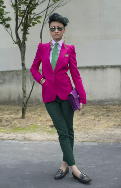 bright pink jacket and dark green trousers