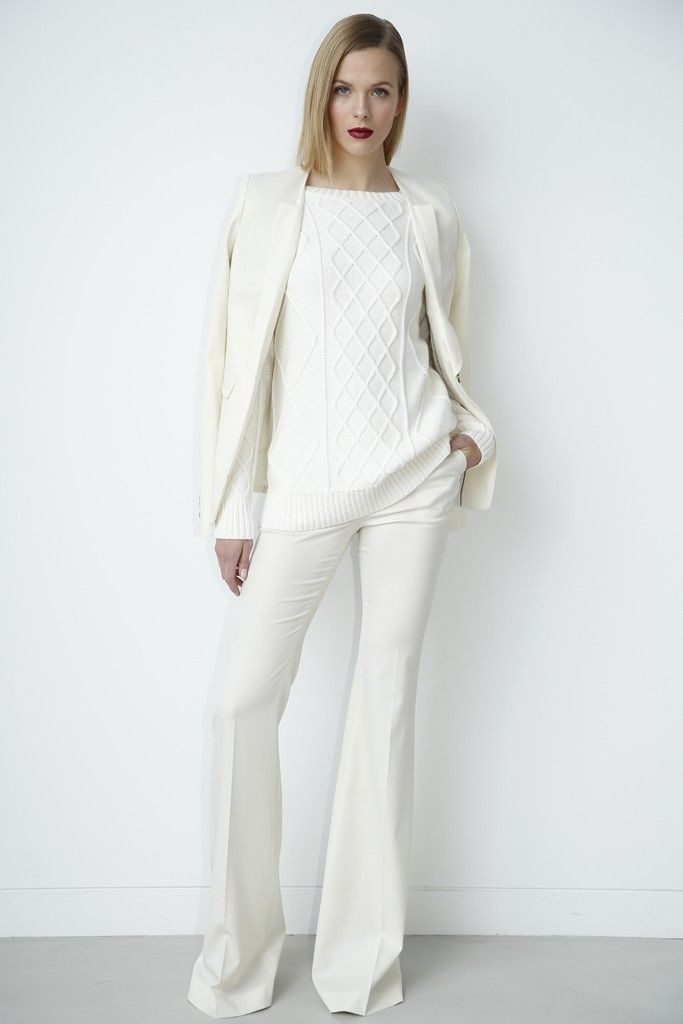 White total look with trousers and a sweater.