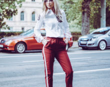 Red pants with a white shirt.