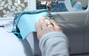 the first scraps are sewn on a machine