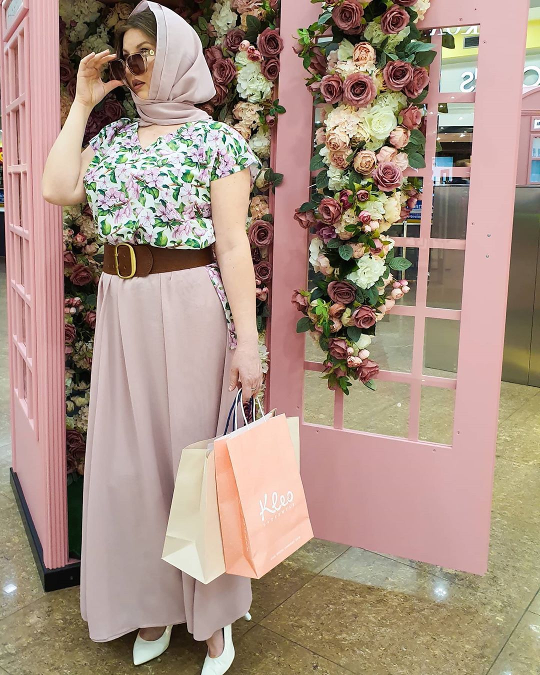 Floor-length skirt with floral blouse and scarf