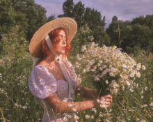 Girl with flowers and in a dress