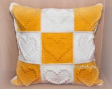 White and orange motif pillow